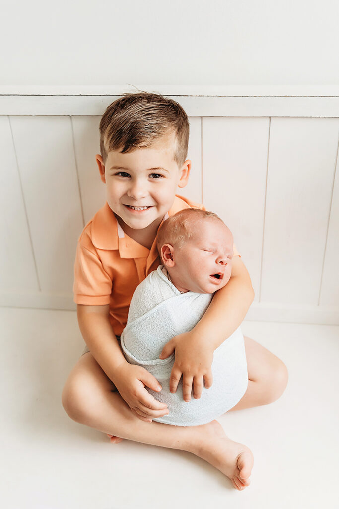 big brother holding baby brother