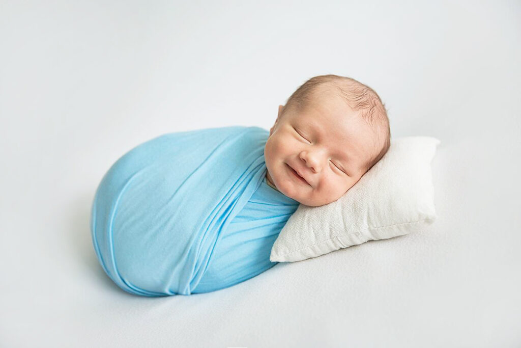 smiling newborn baby