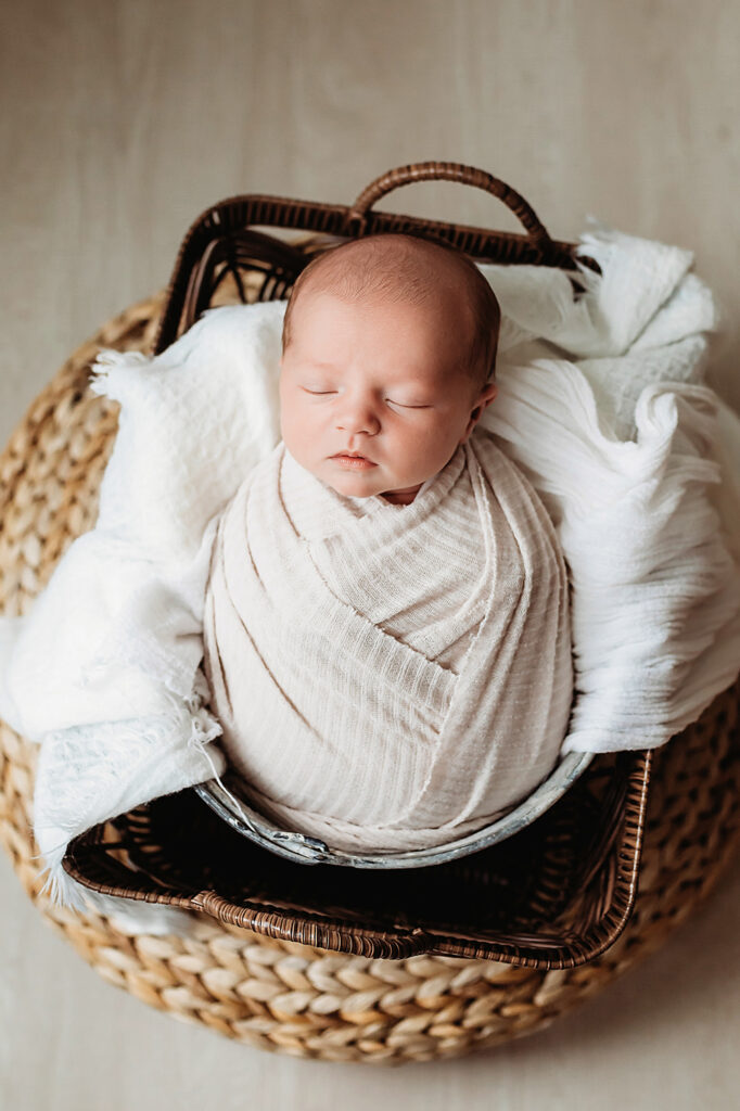 newborn baby in basket