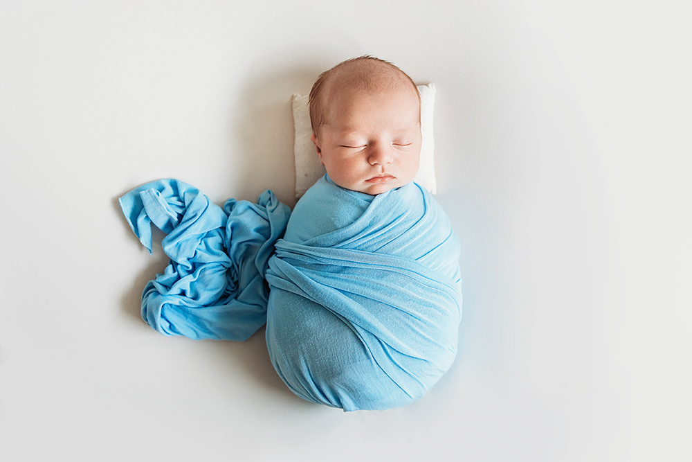 baby boy newborn swaddled