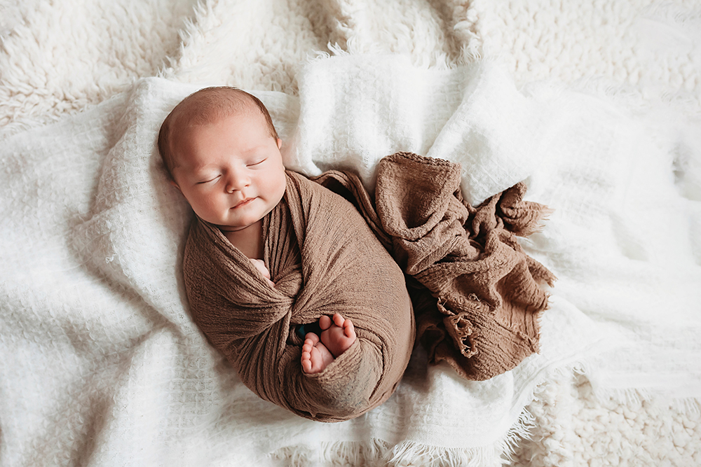 newborn smiling baby photographer