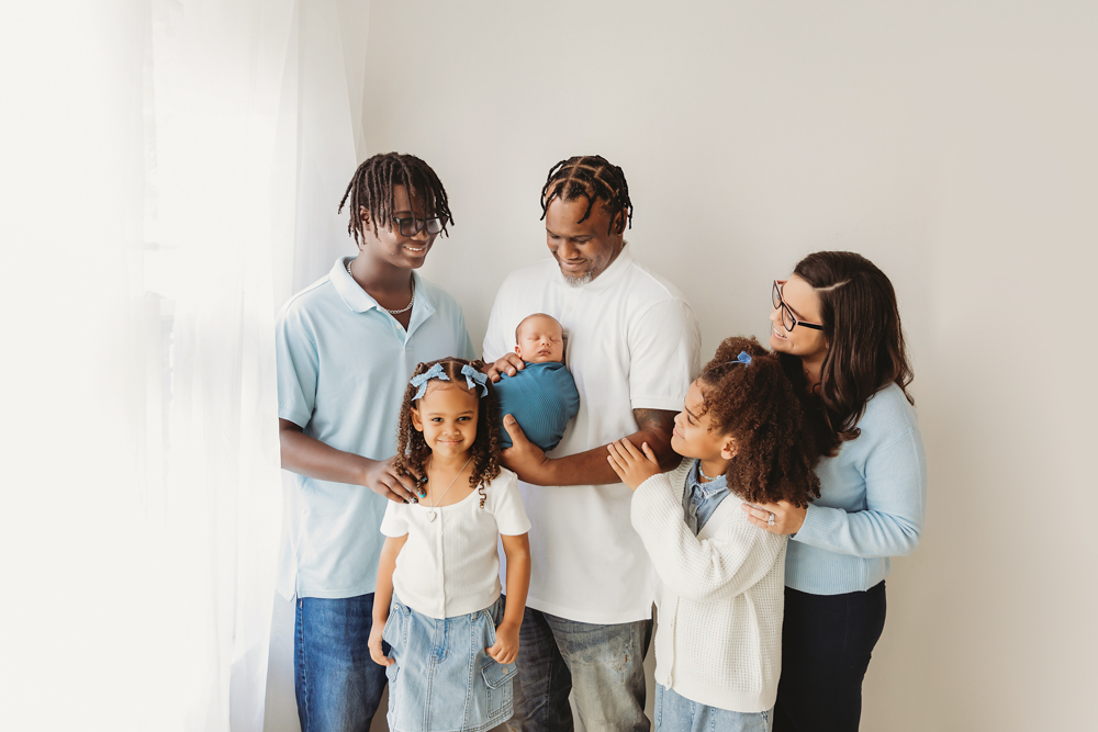 newborn baby pose blended family