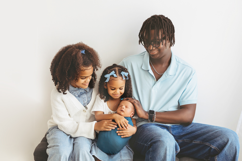 newborn baby with siblings pose