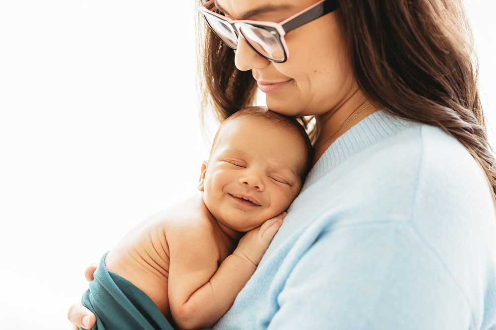 newborn baby smiling