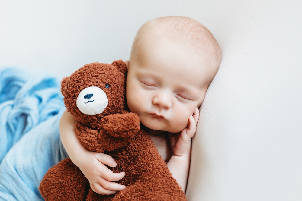 newborn baby boy with teddy bear