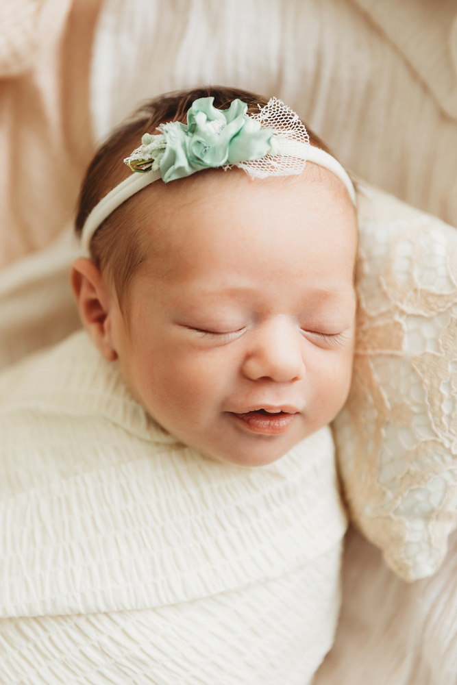 newborn baby smiling