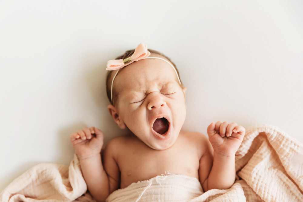 newborn baby yawning