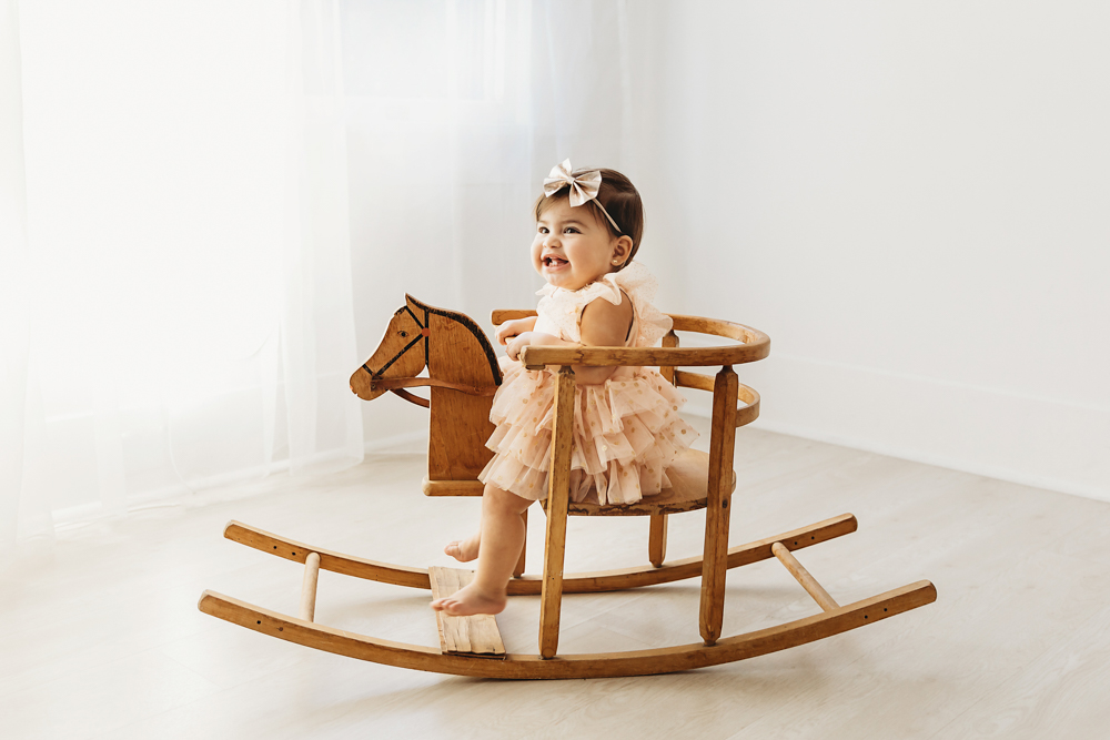 baby in a rocking horse