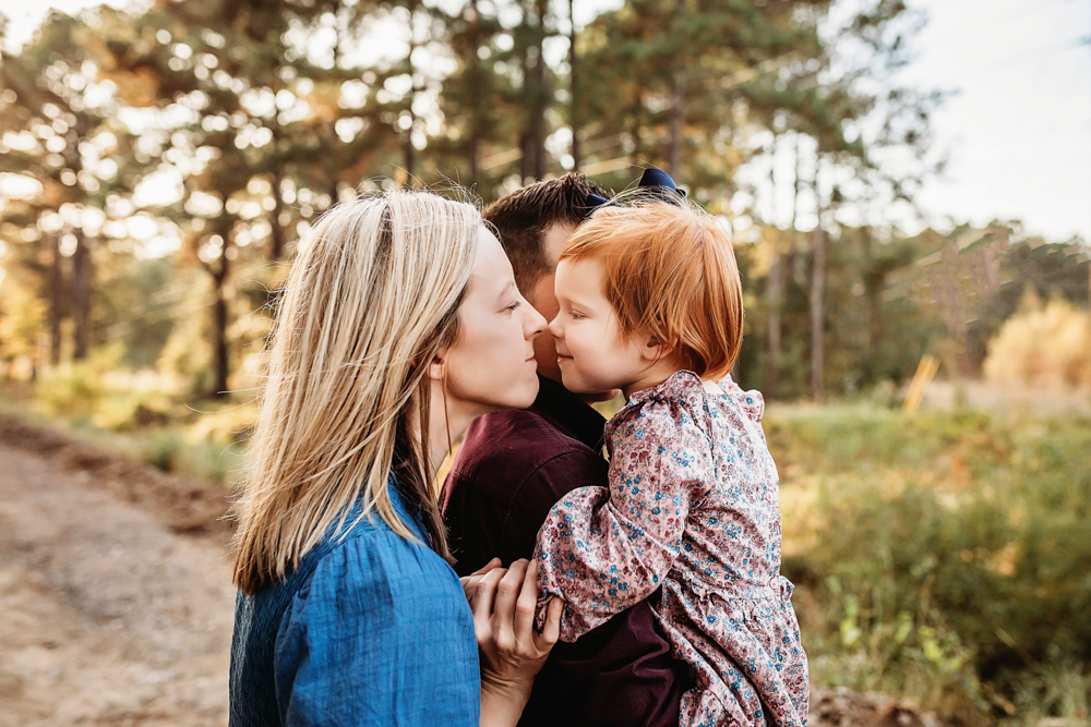 little girl kissing mommy