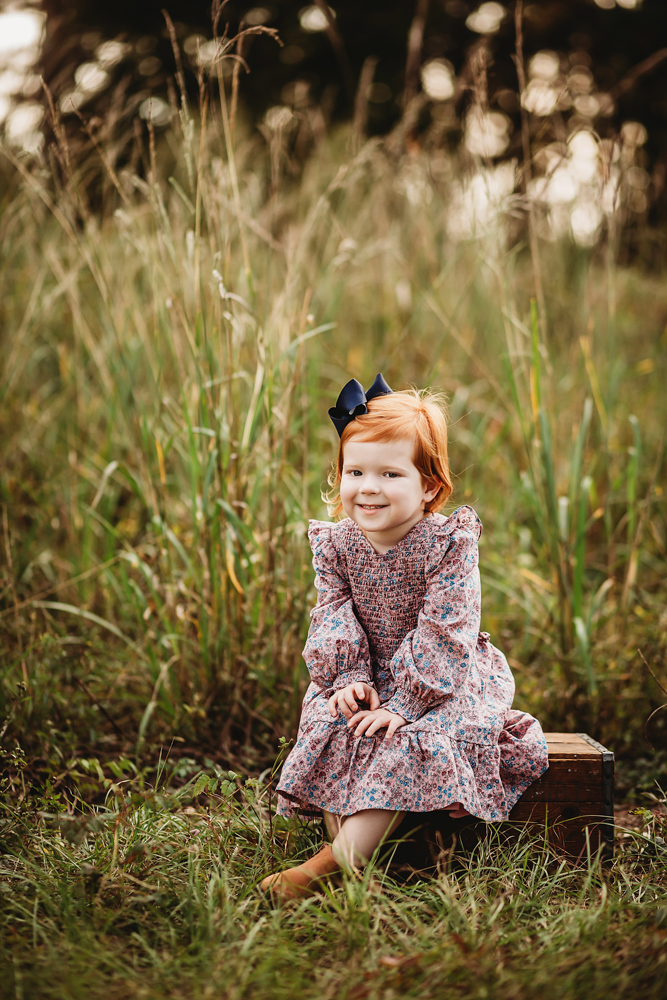 red head girl in field