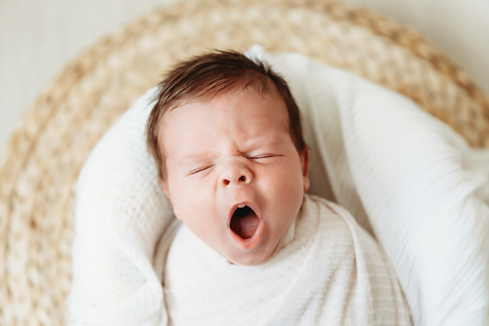 newborn baby yawning