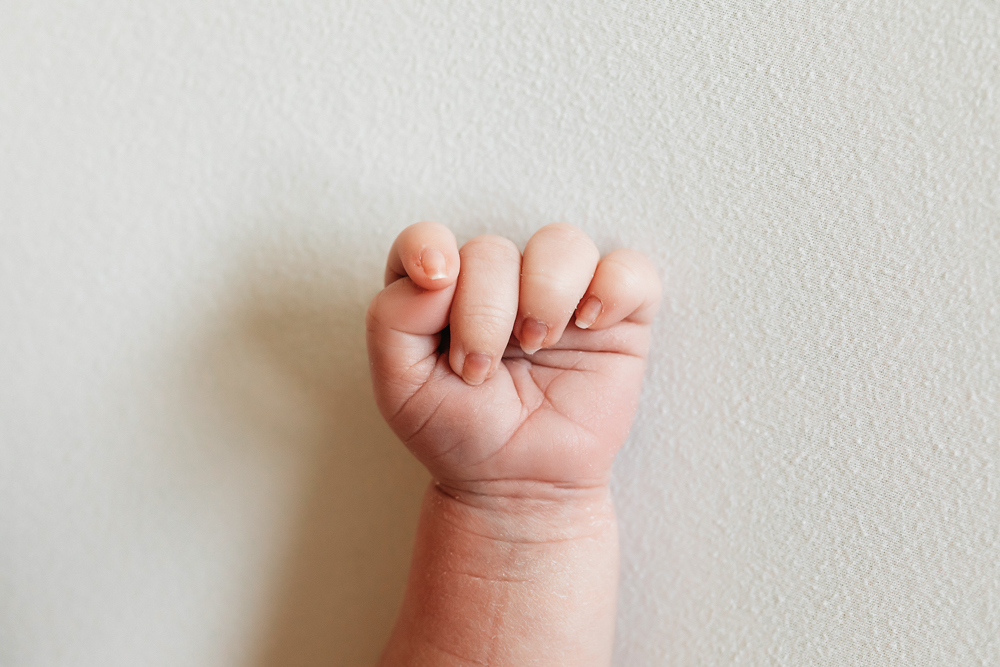 newborn baby fist closeup