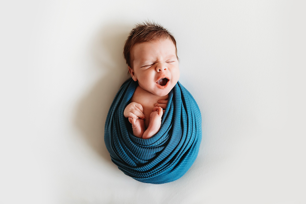 newborn baby yawning