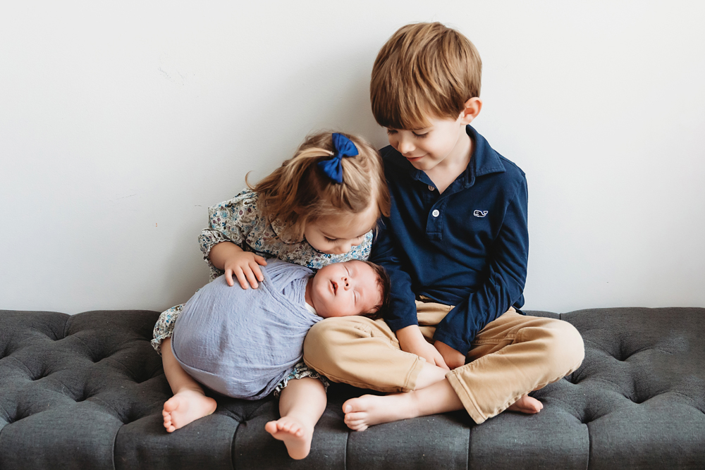 newborn baby with brother and sister