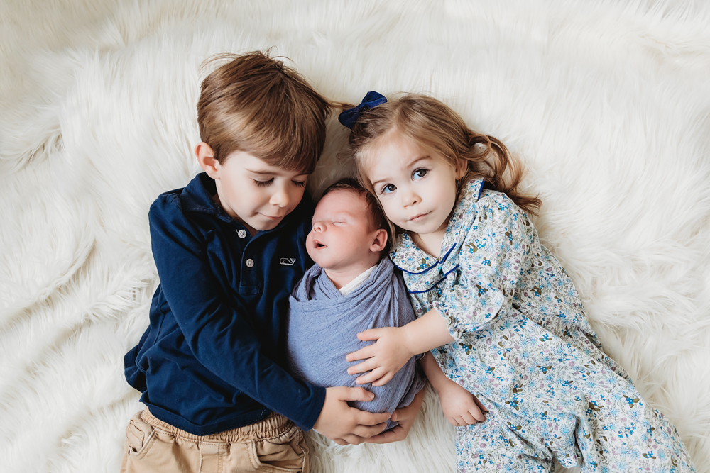 newborn baby boy with brother and sister