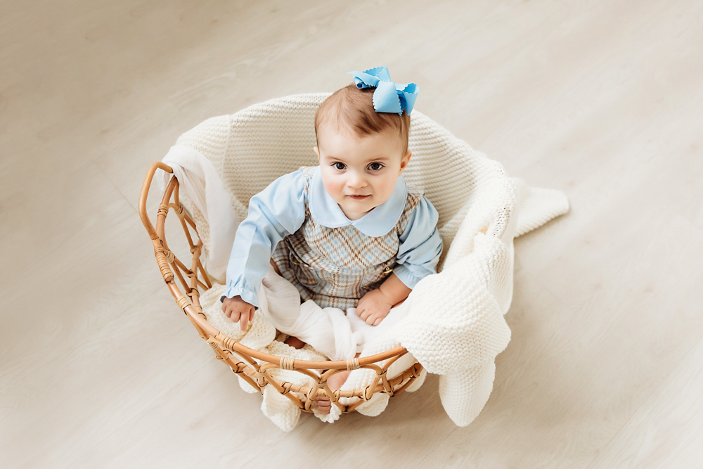 baby in a basket photo session