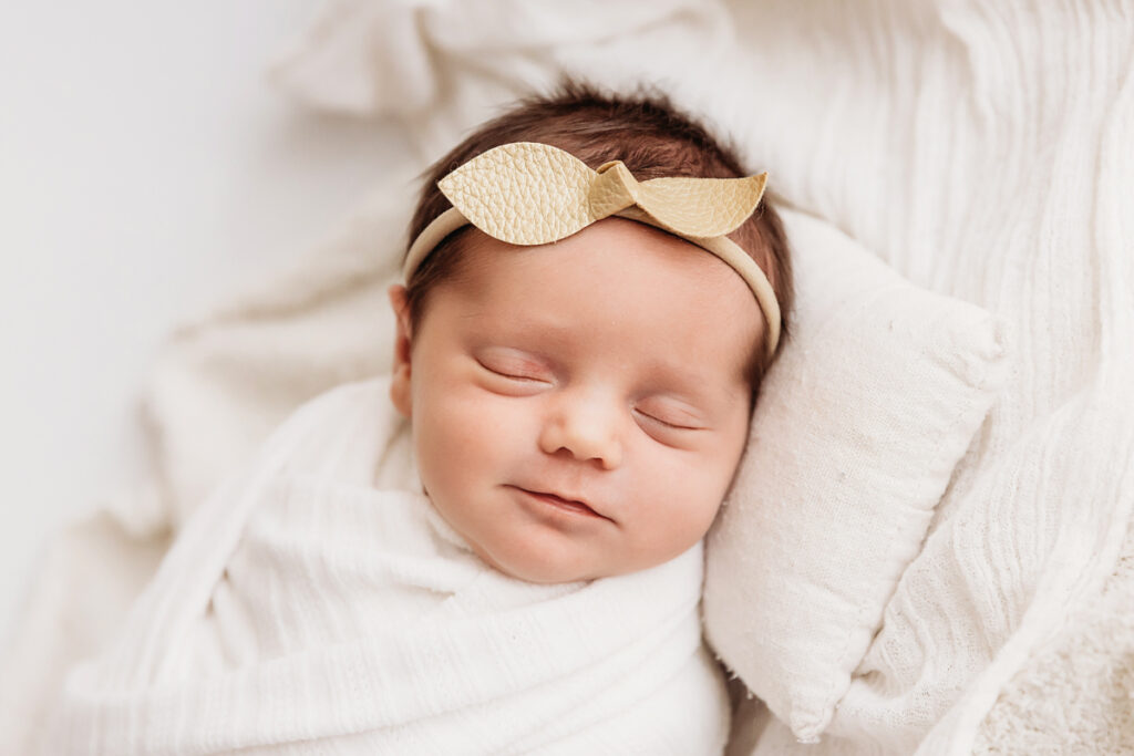 newborn baby smiling