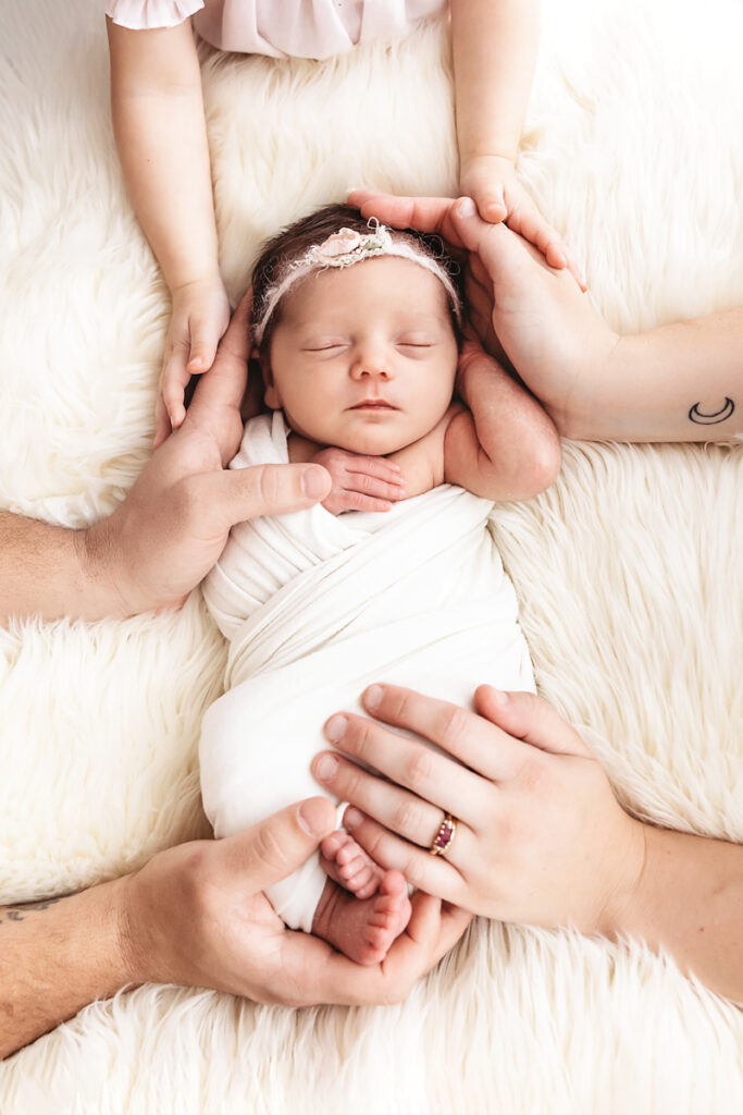 family holding new baby