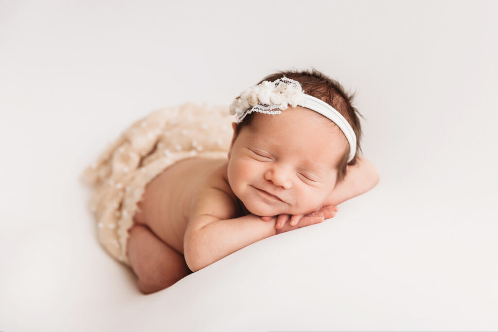 smiling sleeping baby newborn photo session