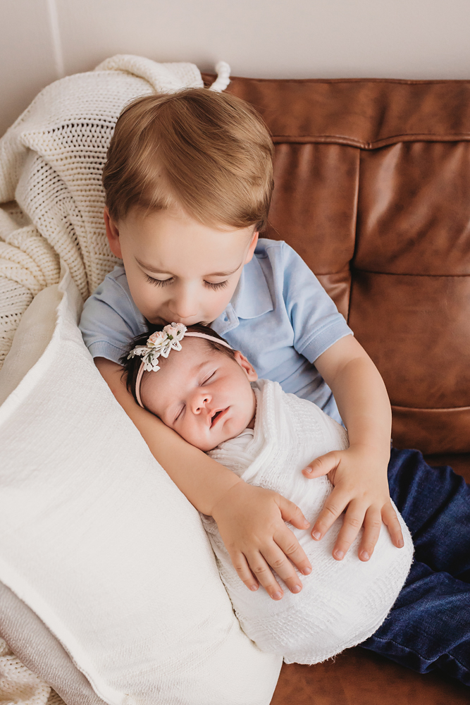 brother holding baby sister
