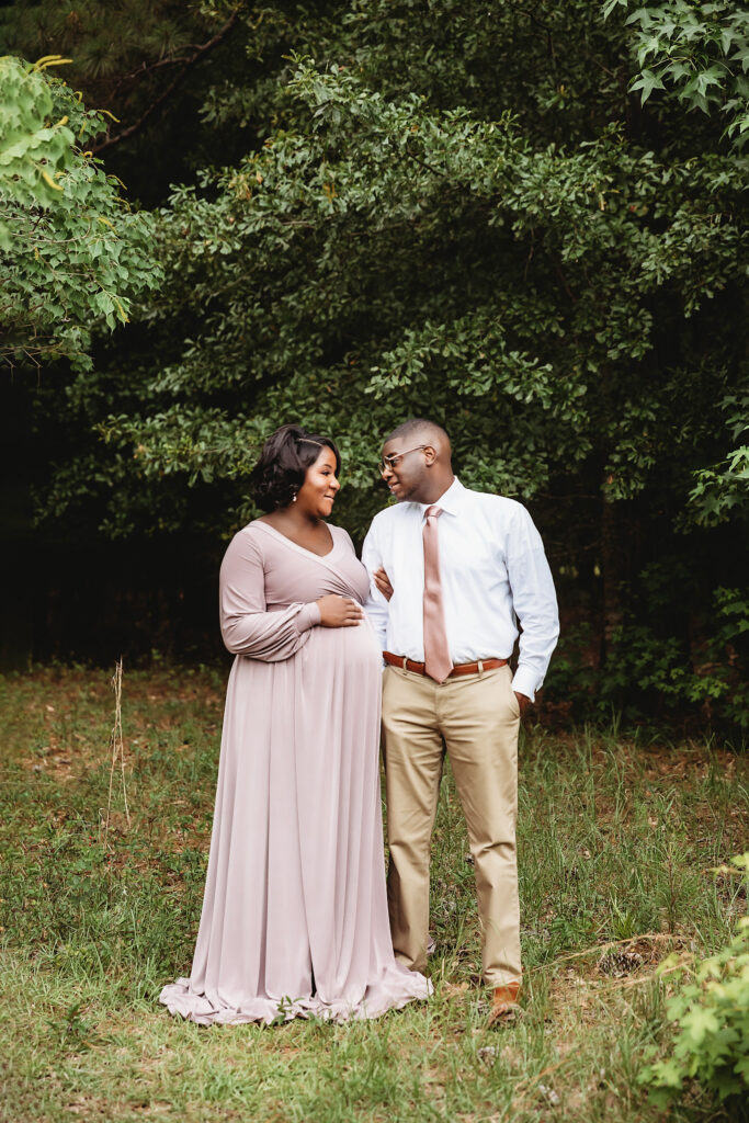 Arm in arm, smiling together in field at Reflection Images by Tracy Rowell in Florence SC