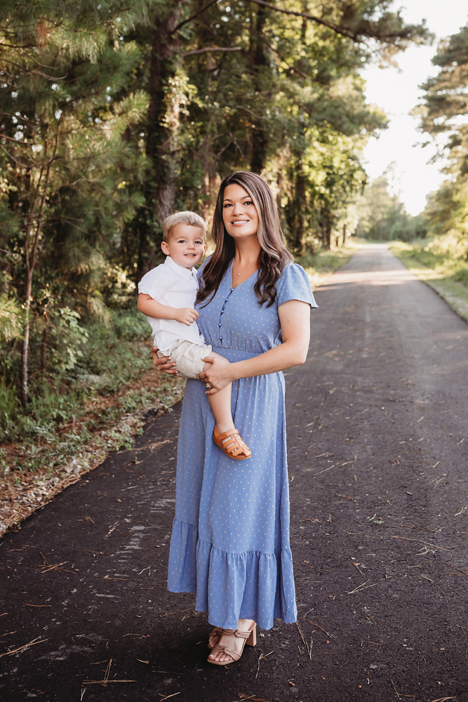 boy peek shoulder with natural light, smiles, and love at Reflection Images by Tracy Rowell in Florence SC