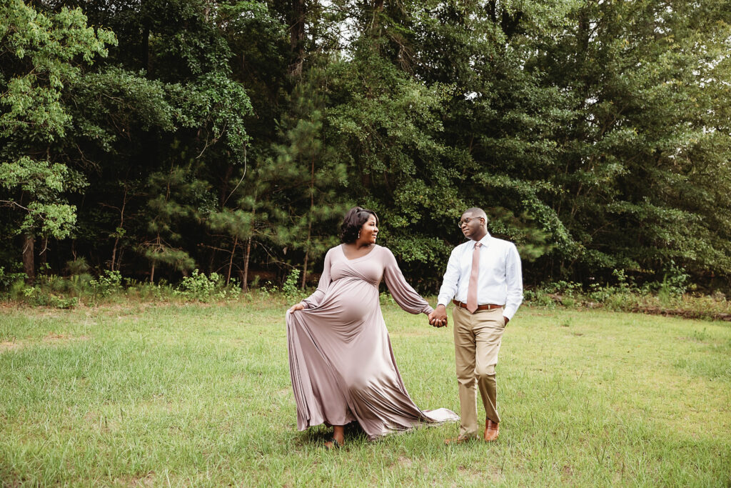 Chelsea lifts her gown hem while walking hand in hand with partner, lively moment in Florence SC.