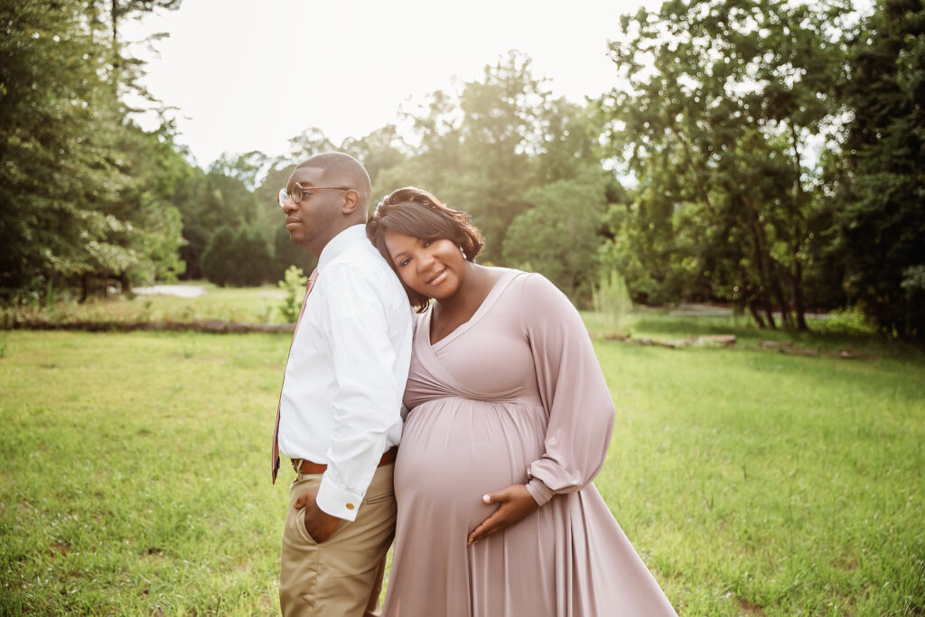 Close up as Chelsea rests her head on his back, tender moment in natural light at Reflection Images in Florence SC.
