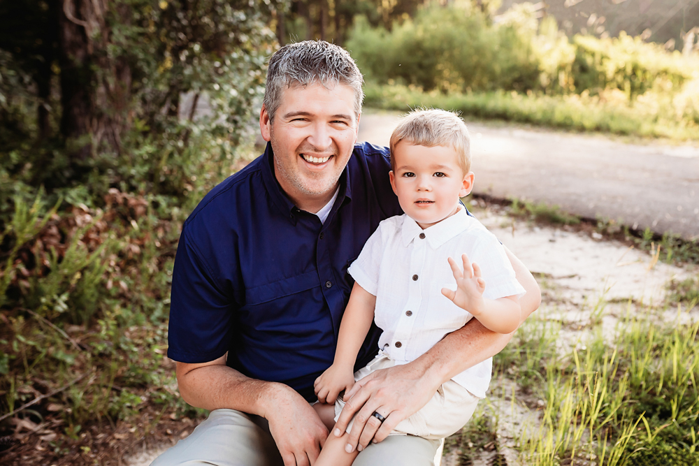 son on dad shoulder with natural light, smiles, and love at Reflection Images by Tracy Rowell in Florence SC