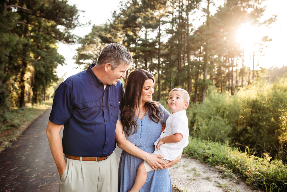 family trail walk with natural light, smiles, and love at Reflection Images by Tracy Rowell in Florence SC