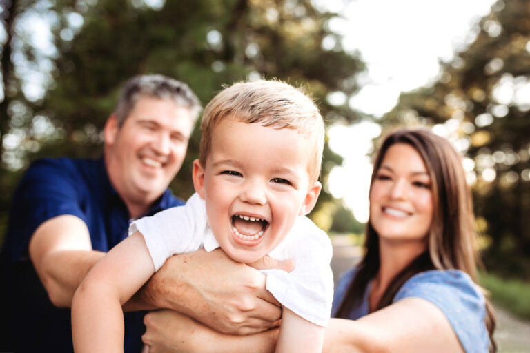 toddler toss air with natural light, smiles, and love at Reflection Images by Tracy Rowell in Florence SC