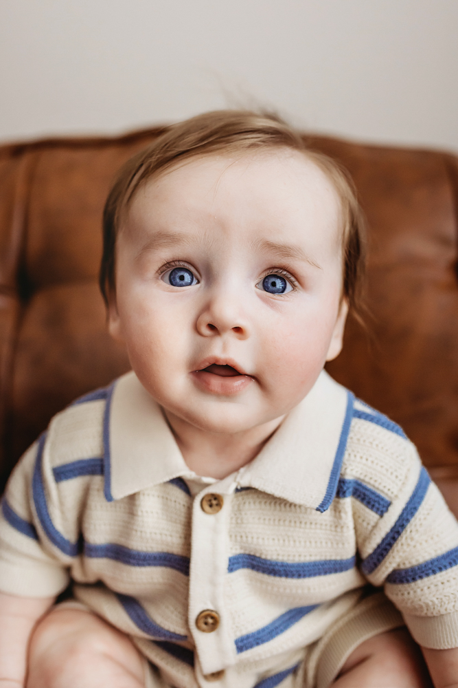 Close-up of baby boys face with blue eyes, professional milestone session Florence SC