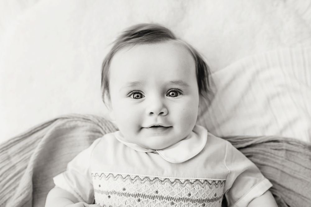 Black and white portrait of smiling baby boy, milestone session Reflection Images by Tracy Rowell