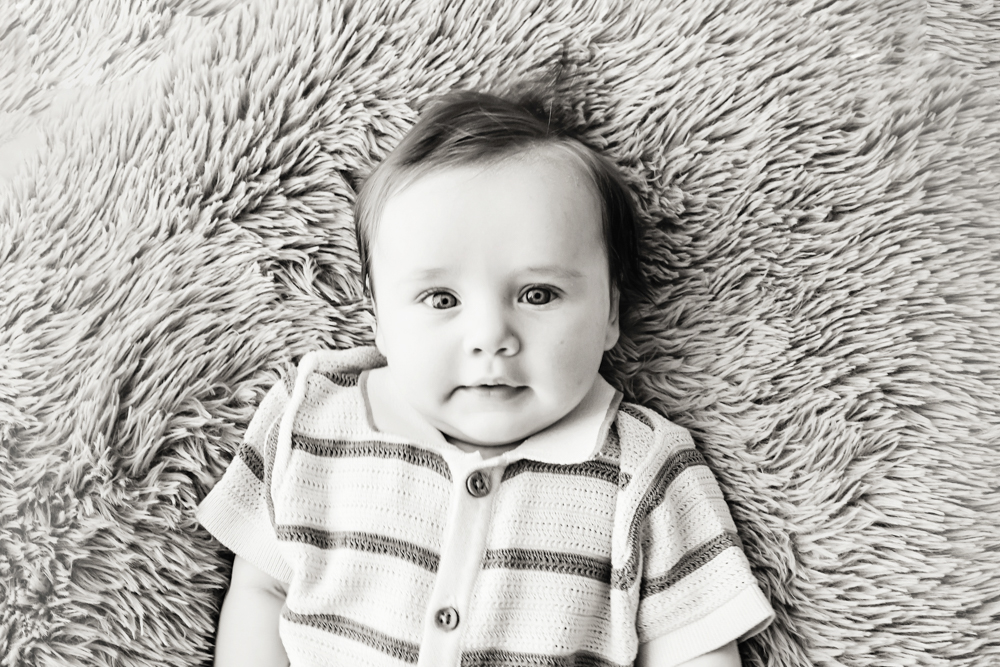 Black and white baby portrait on fuzzy blanket, professional photography near Florence SC