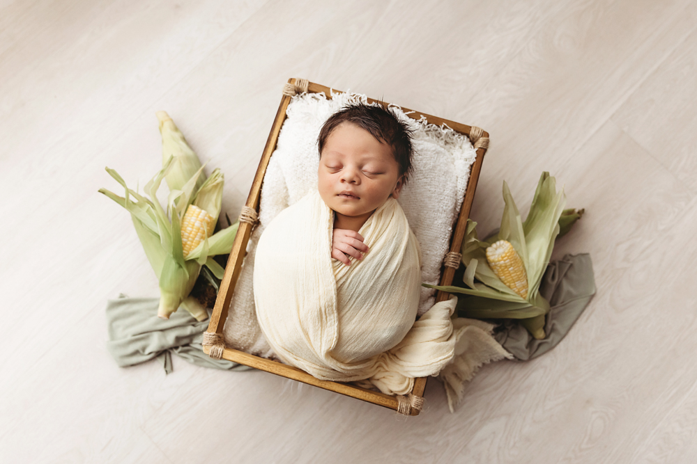 baby light yellow wrap in basket florence sc