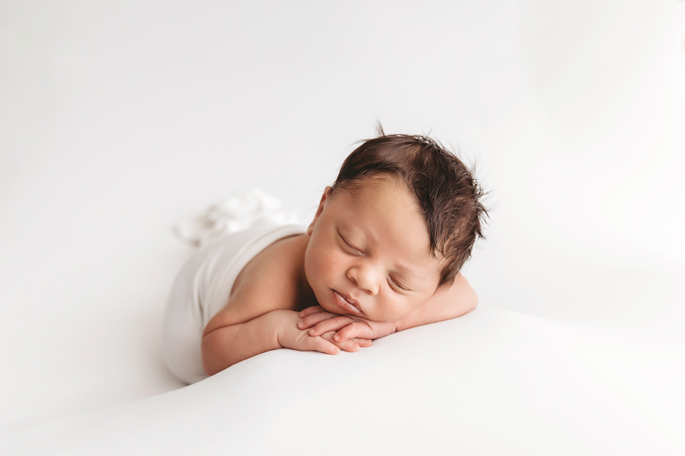baby sleeping resting on hands side view florence sc