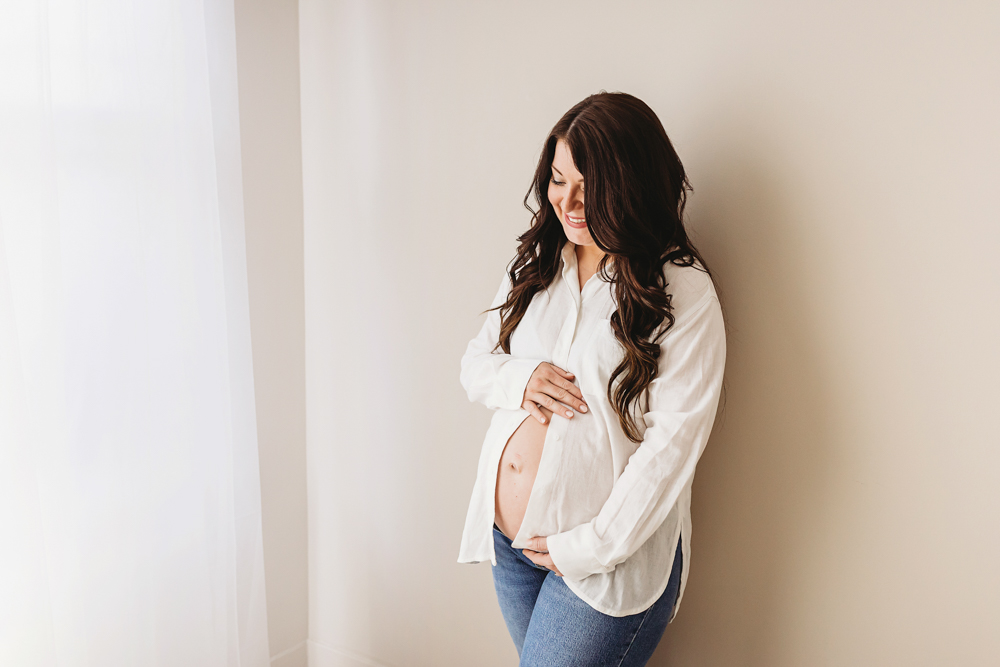 Buenrostro classic maternity portrait standing in warm, joyful feel with candid connection at Reflection Images by Tracy Rowell in Florence SC