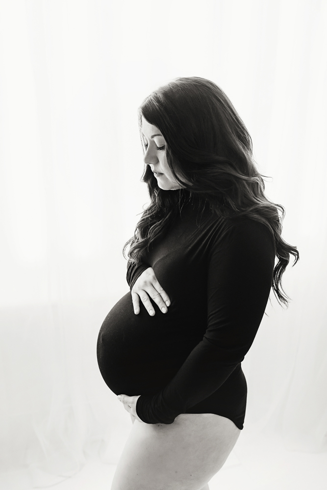Buenrostro maternity black bodysuit profile in warm, joyful feel with candid connection at Reflection Images by Tracy Rowell in Florence SC