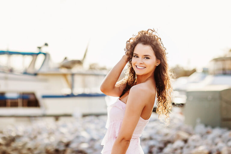 reflection images candid over-the-shoulder smile of hayden in coastal Georgetown SC golden hour curls