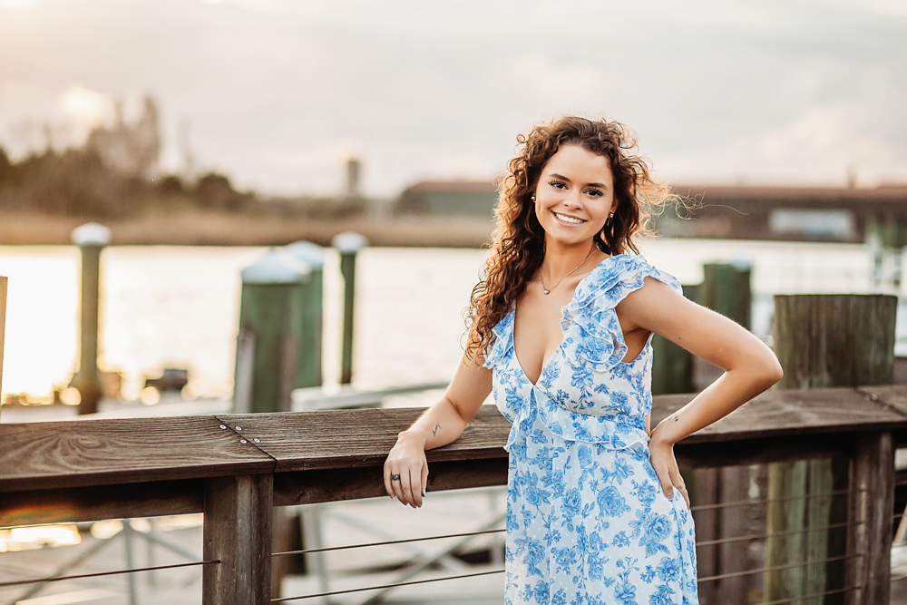 hayden leaning on pier railing smiling warmly Georgetown SC