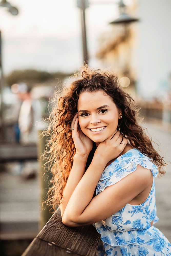 golden hour close-up of hayden smiling with hair glowing Georgetown SC by reflection images