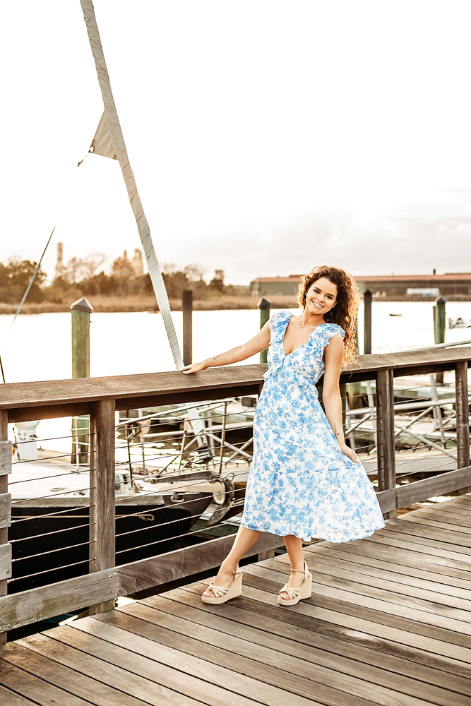 hayden laughing with hair in wind by docked boats Georgetown SC