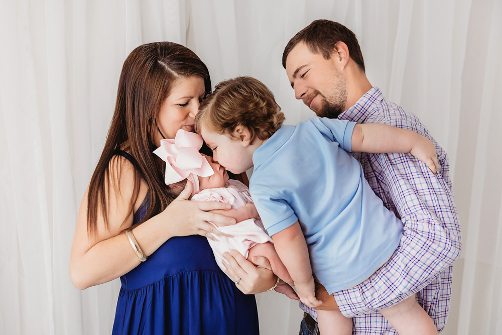 Baby Logan kiss on forehead at Reflection Images by Tracy Rowell in Florence SC