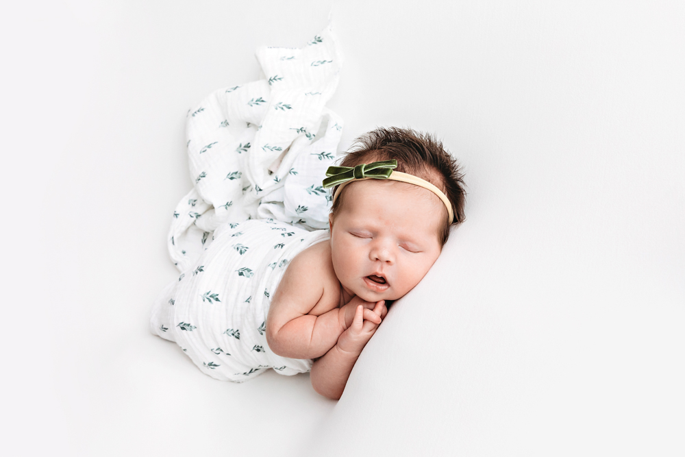 Baby Logan wrapped in cream at Reflection Images by Tracy Rowell in Florence SC