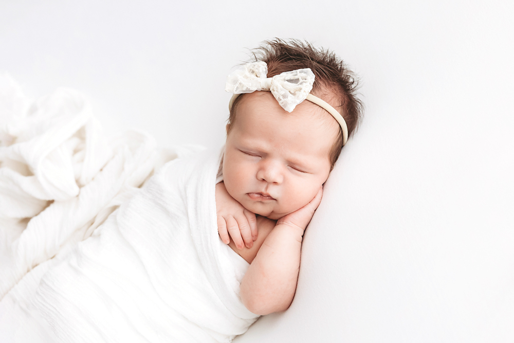 Baby Logan wrapped in white at Reflection Images by Tracy Rowell in Florence SC