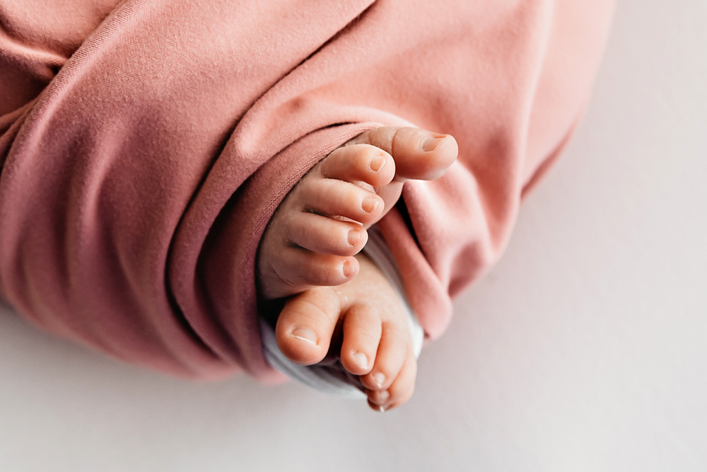Macro close-up of Millie Jo tiny toes wrapped in dusty pink at Reflection Images by Tracy Rowell in Florence SC