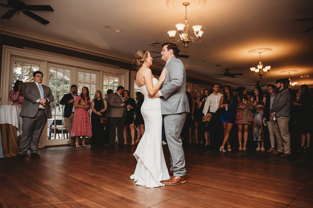 Romantic first dance moment of bride and groom on the dance floor at Reflection Images by Tracy Rowell in Florence SC