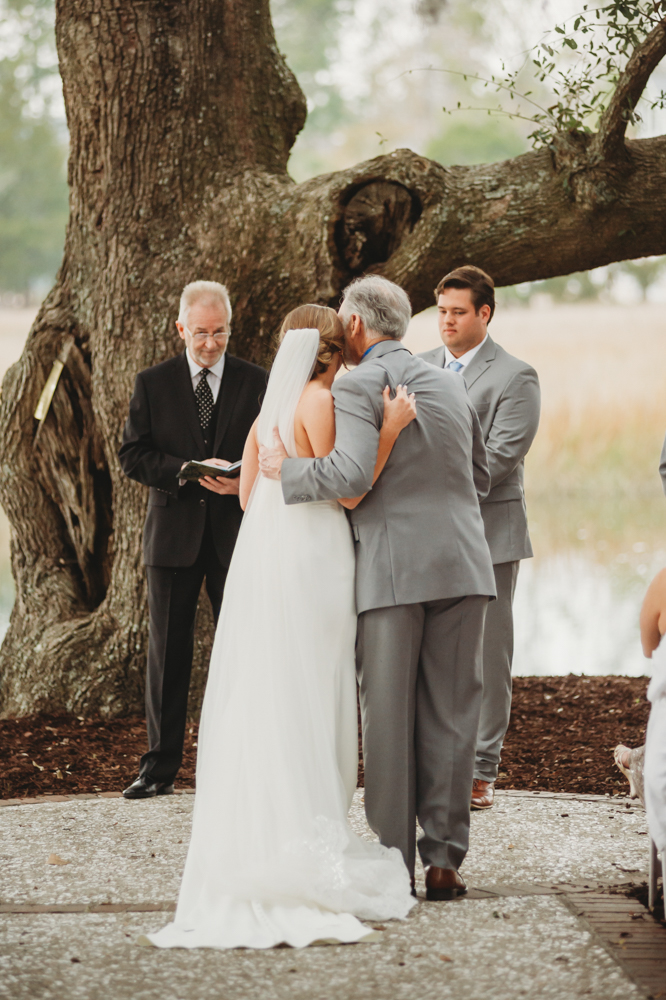 Wedding ceremony with vows and emotional moments on scenic Daniel Island at Reflection Images by Tracy Rowell in Florence SC