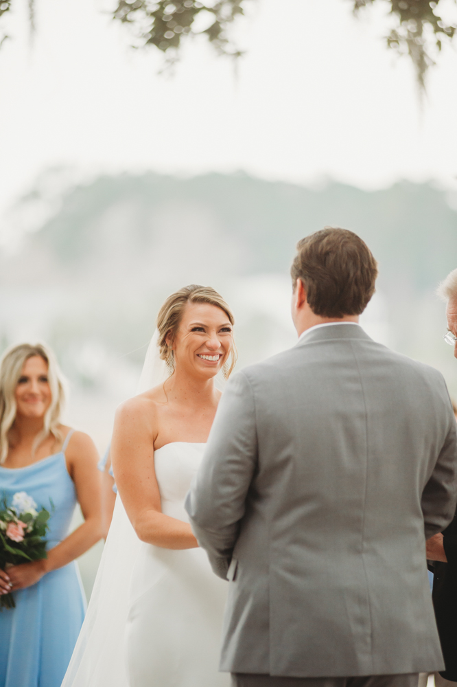 Wedding ceremony with vows and emotional moments on scenic Daniel Island at Reflection Images by Tracy Rowell in Florence SC