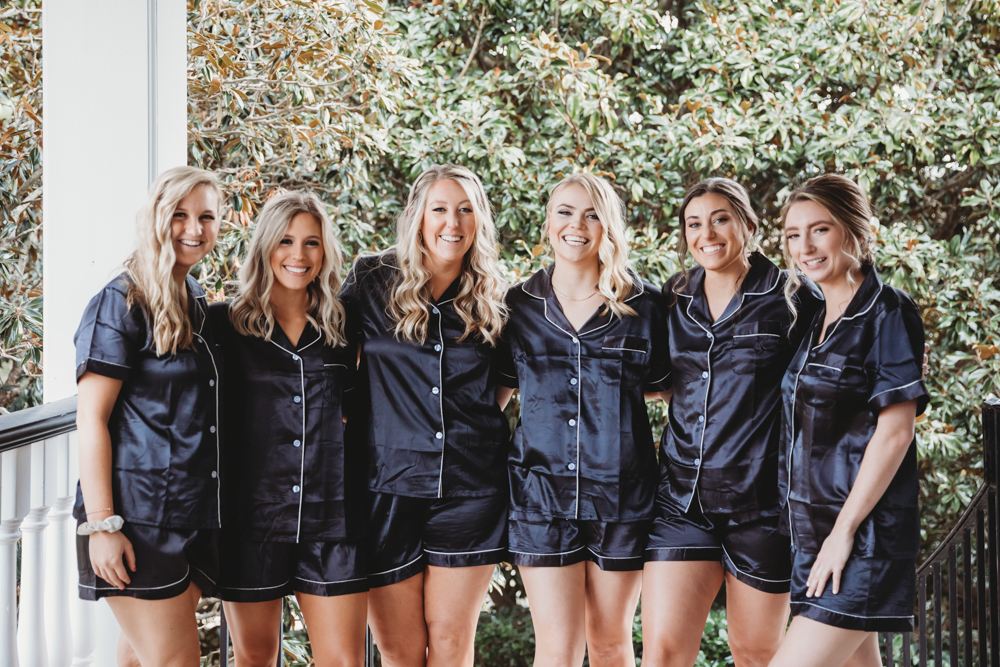 Bridal party group photo with fashionable gowns and suits at Reflection Images by Tracy Rowell in Florence SC